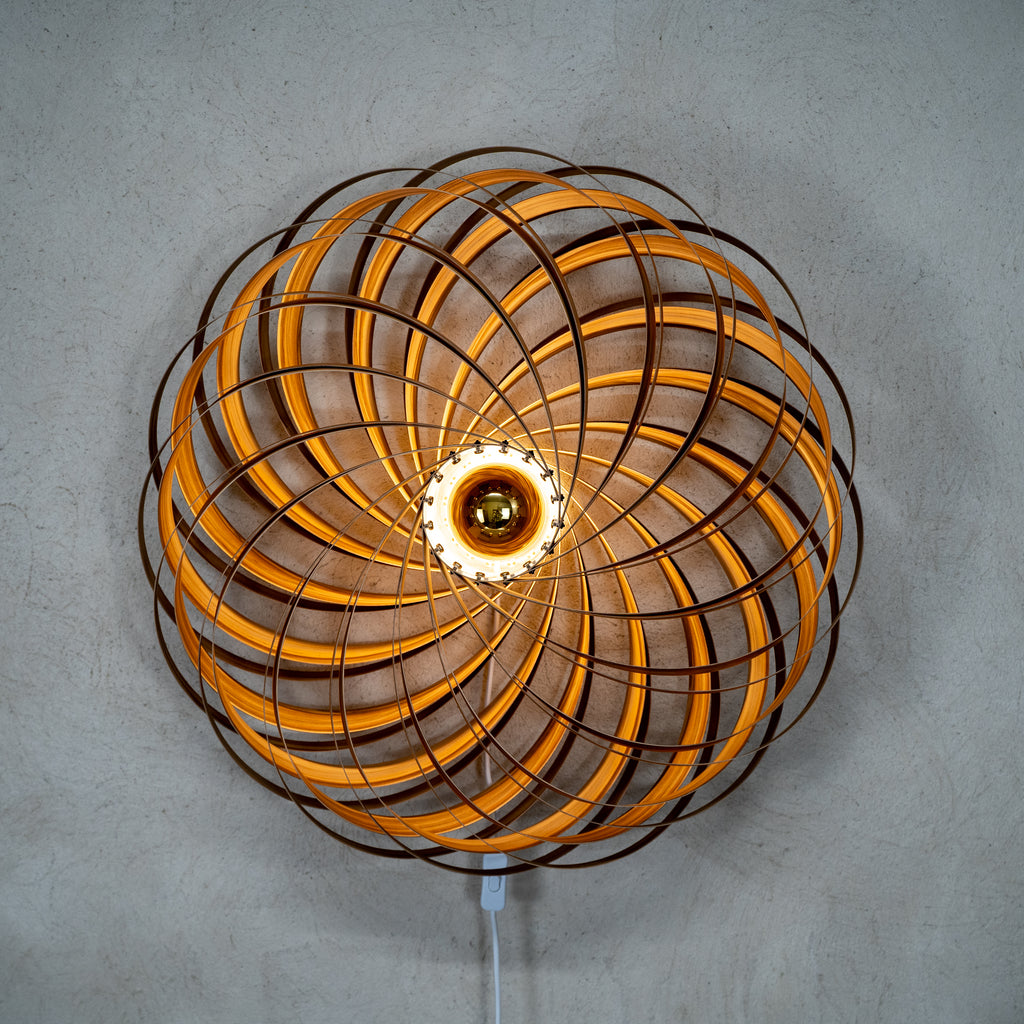 Beautiful to look at from the front, our wooden wall lamp Veneria